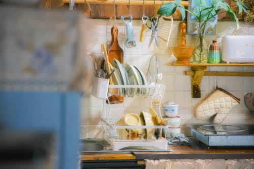 A kitchen with a lot of dishes and utensils