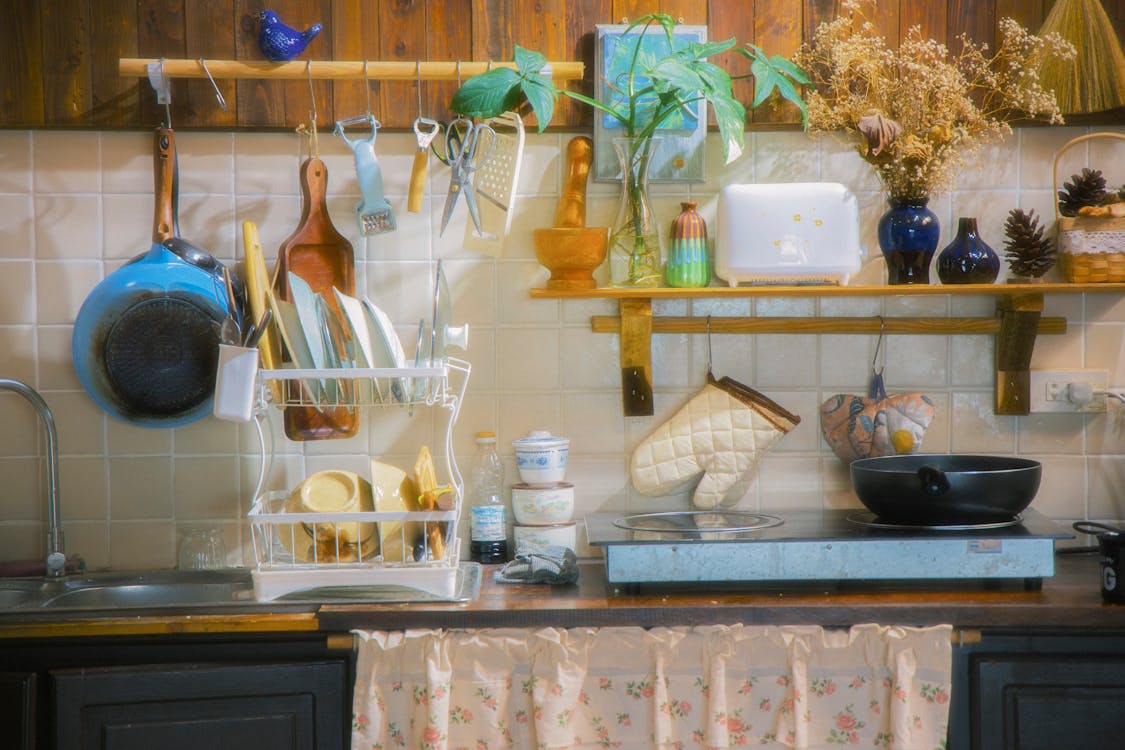 Free A kitchen with a stove, sink and pots and pans Stock Photo