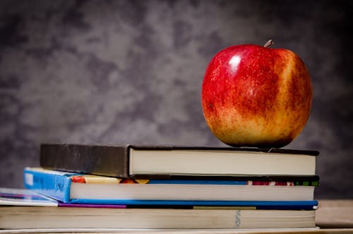 Free Close-up of Apple on Top of Books Stock Photo