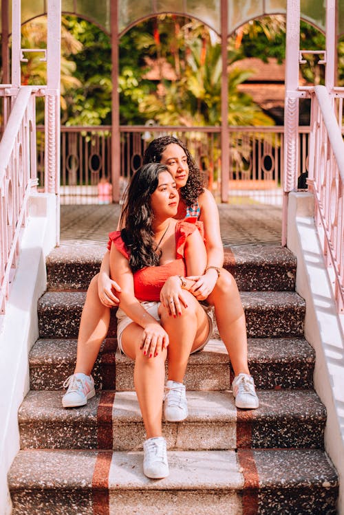 A Couple Sitting On the Stairs