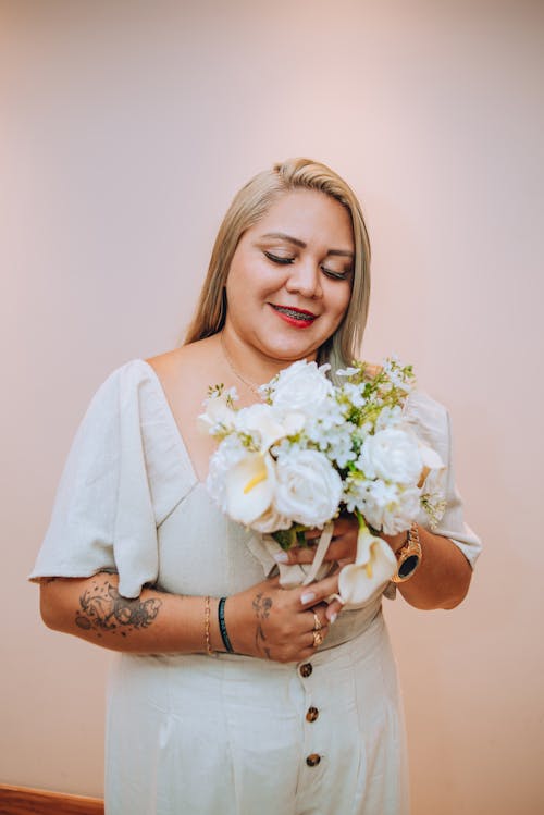 A woman holding a bouquet of flowers