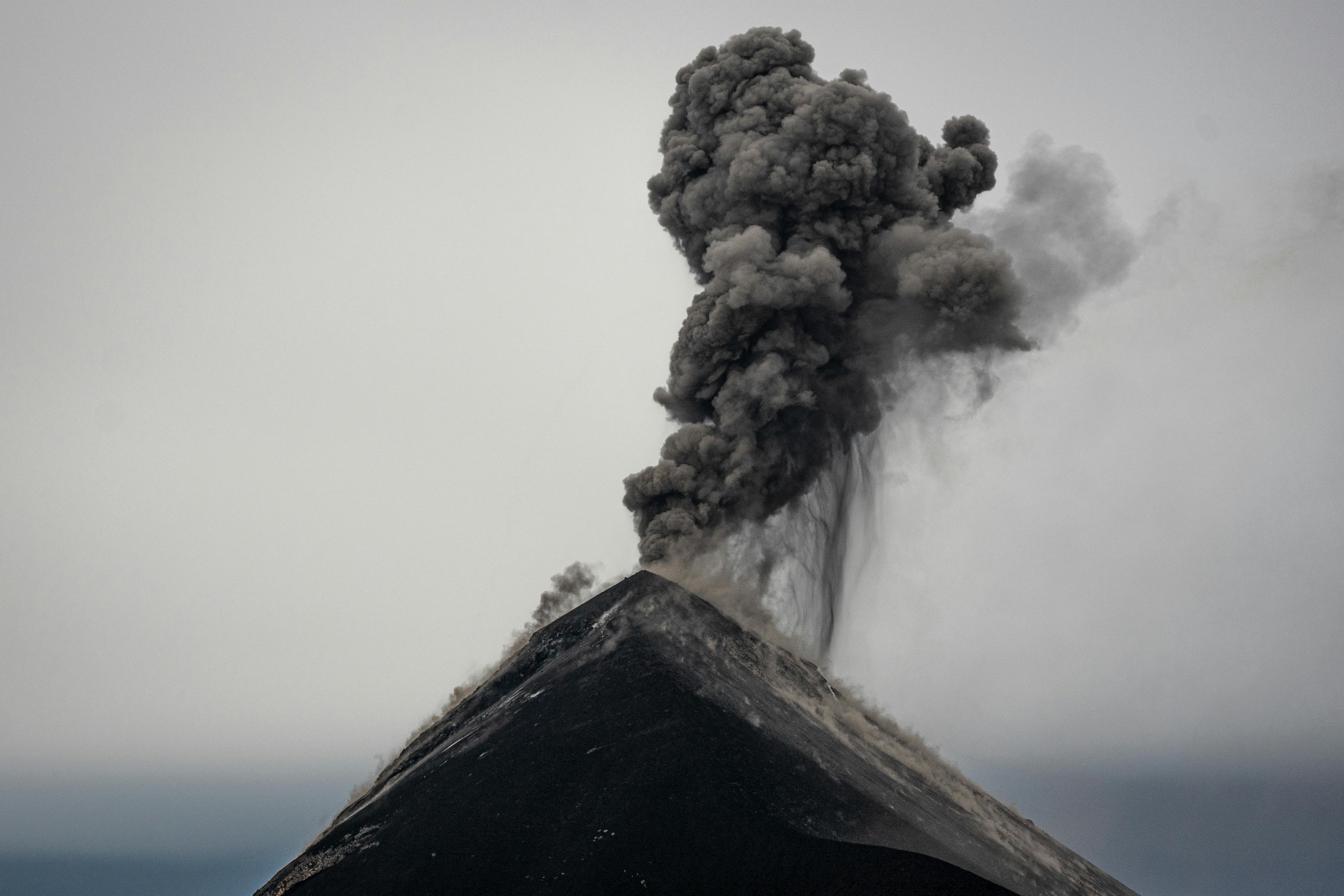 Ash and smoke erupt from Acatenango volcano in Guatemala, capturing nature's raw power.