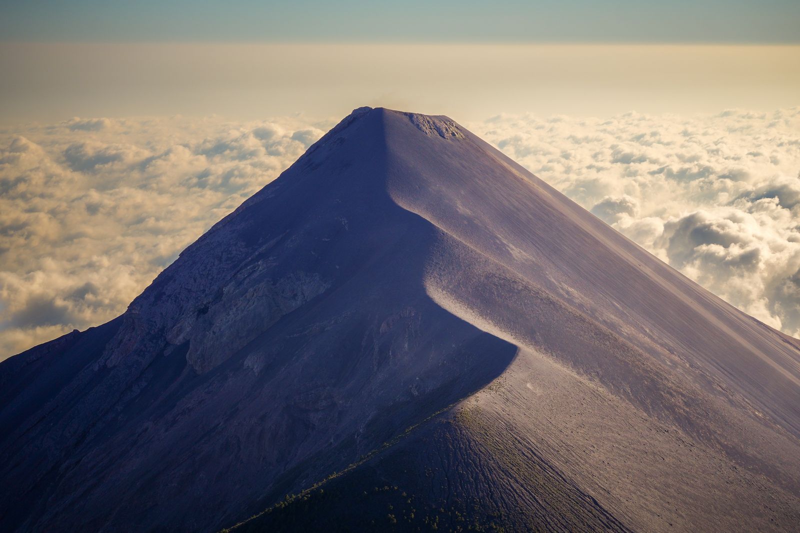 Volcanic ridge above cloud, photo by Diego Girón on Pexels
