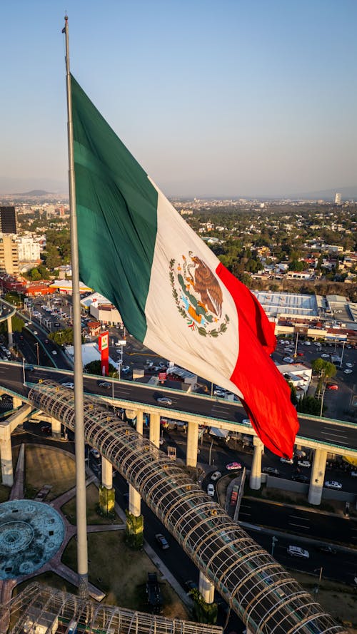 Mexican flag flying over a city