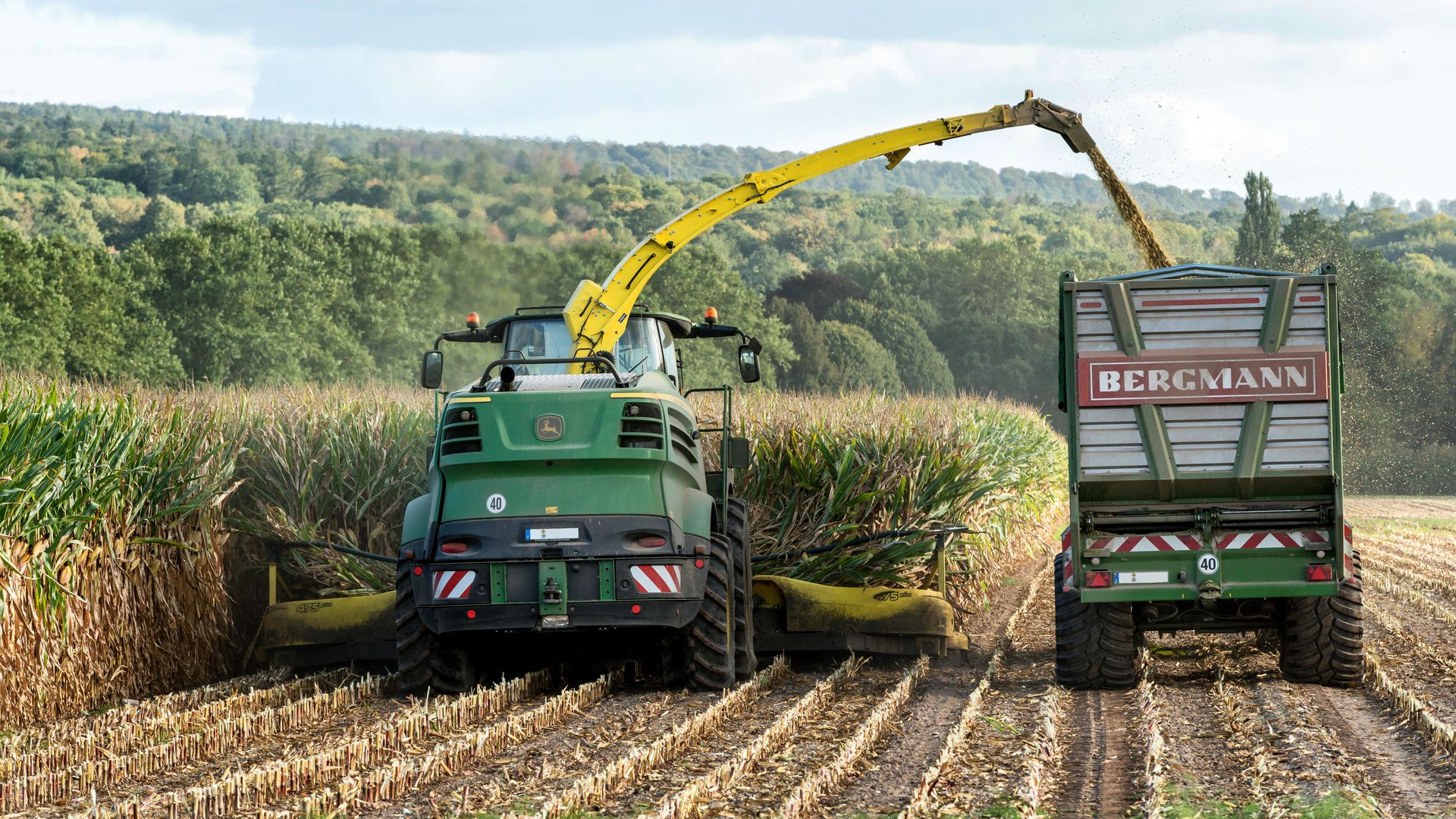 Harvester and Tractor with Trailer on Field
