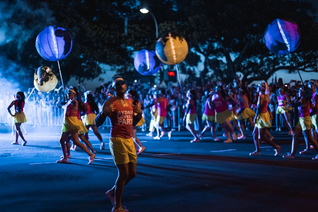 festive street parade with dancers and lanterns at night showcasing vi