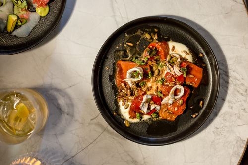 Free A visually appealing flatlay of gourmet seafood and cocktail on marble. Stock Photo