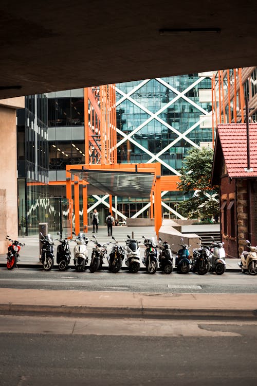 Motorcycles Parked Beside Building