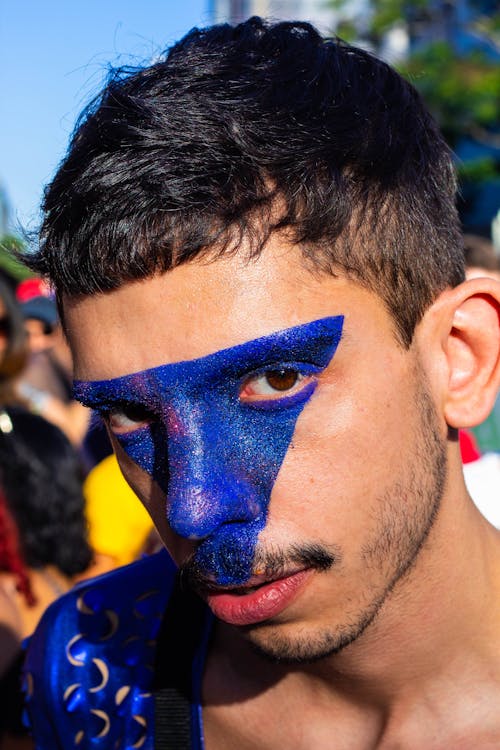 Free Close-Up Photo of Man With Blue Face Paint Stock Photo