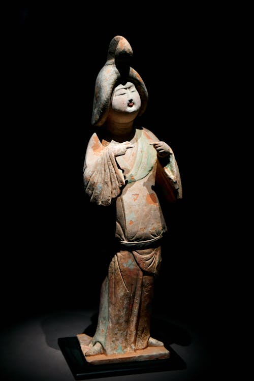 A chinese bronze figure of a woman