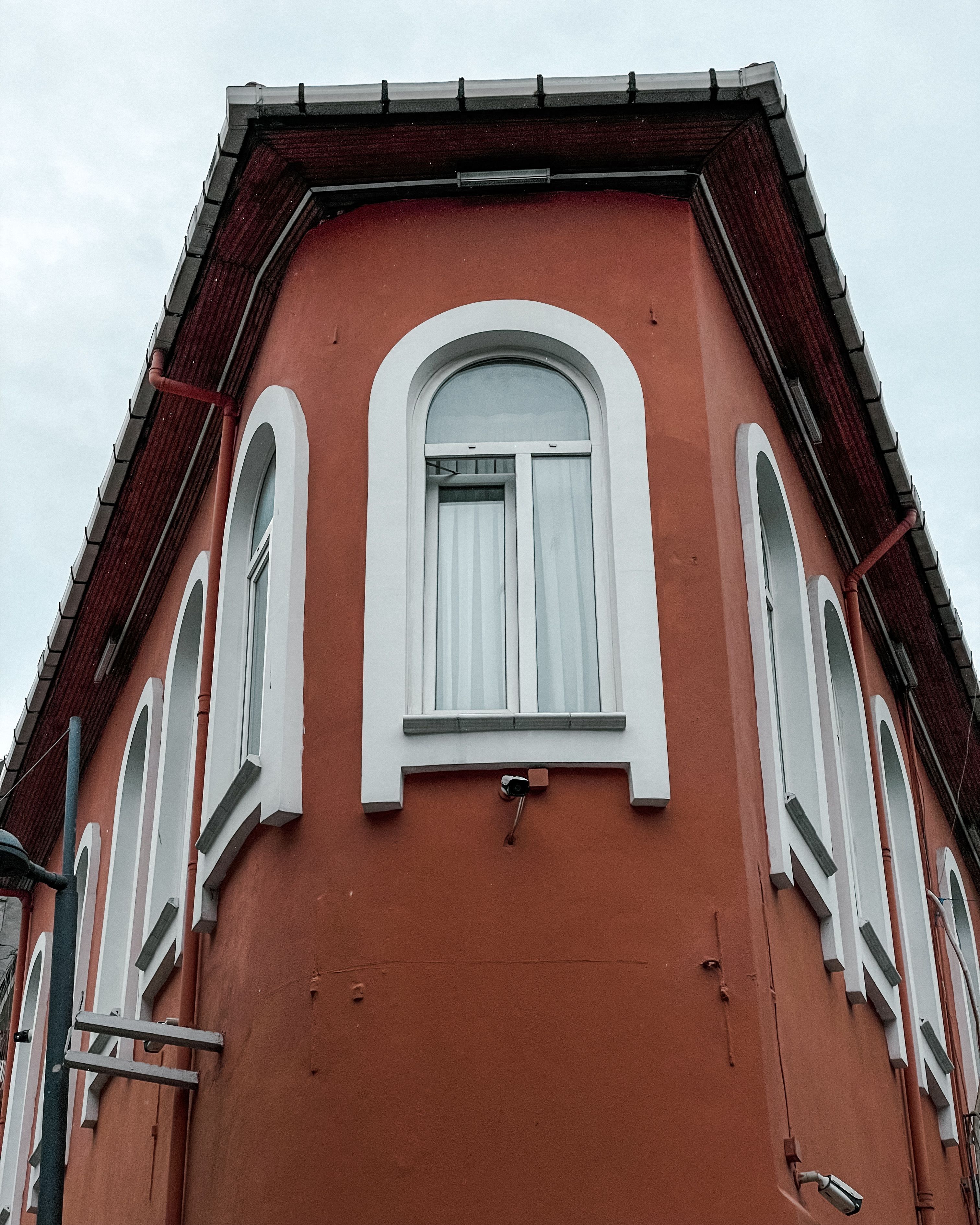 Windows in a Burgundy Tenement · Free Stock Photo