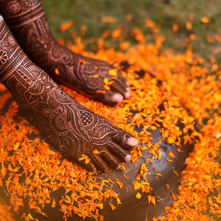 Close-Up Photo of Person's Feet with Tattoos