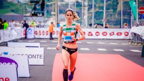 Woman Running in Orange Mat Outdoor