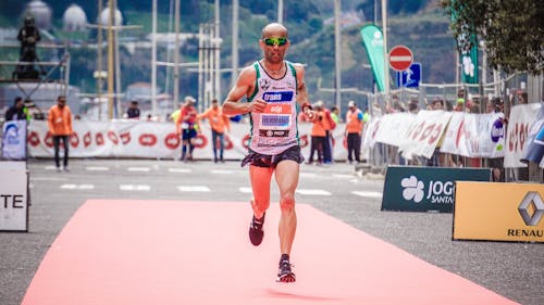 Free Man Running in a Marathon Stock Photo