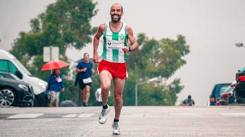 Selective Focus Photography of Man Running on Street