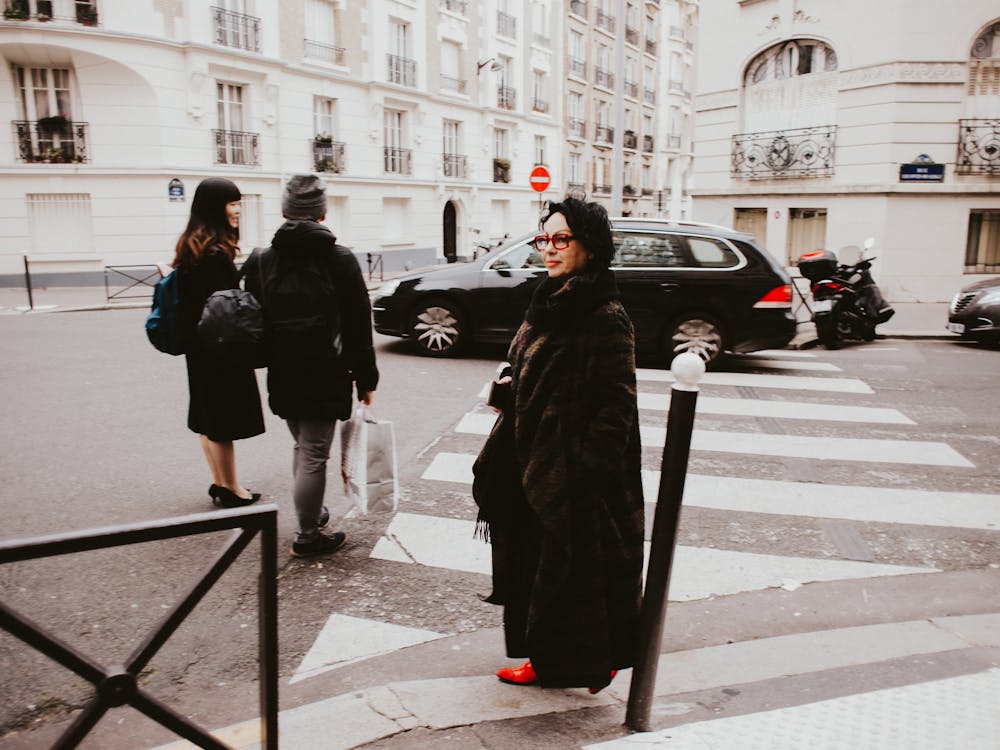 Three People Crossing Pedestrian Lane