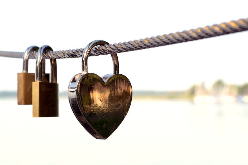 Close-up of Padlocks on Railing Against Sky