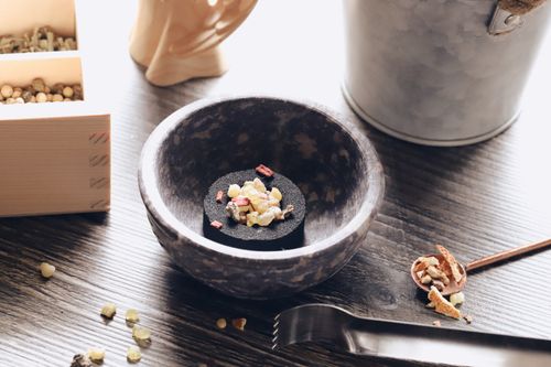 Free A beautifully arranged mix of incense ingredients in a rustic bowl, captured on a wooden table with natural light. Stock Photo