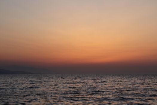 Captivating view of the ocean at sunset with a golden sky, perfect for relaxation themes.