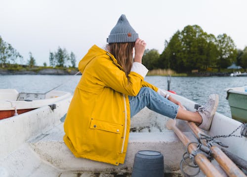 Woman Sitting On White Boat