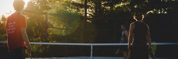 Kids playing tennis at Neighborhood Tennis camp