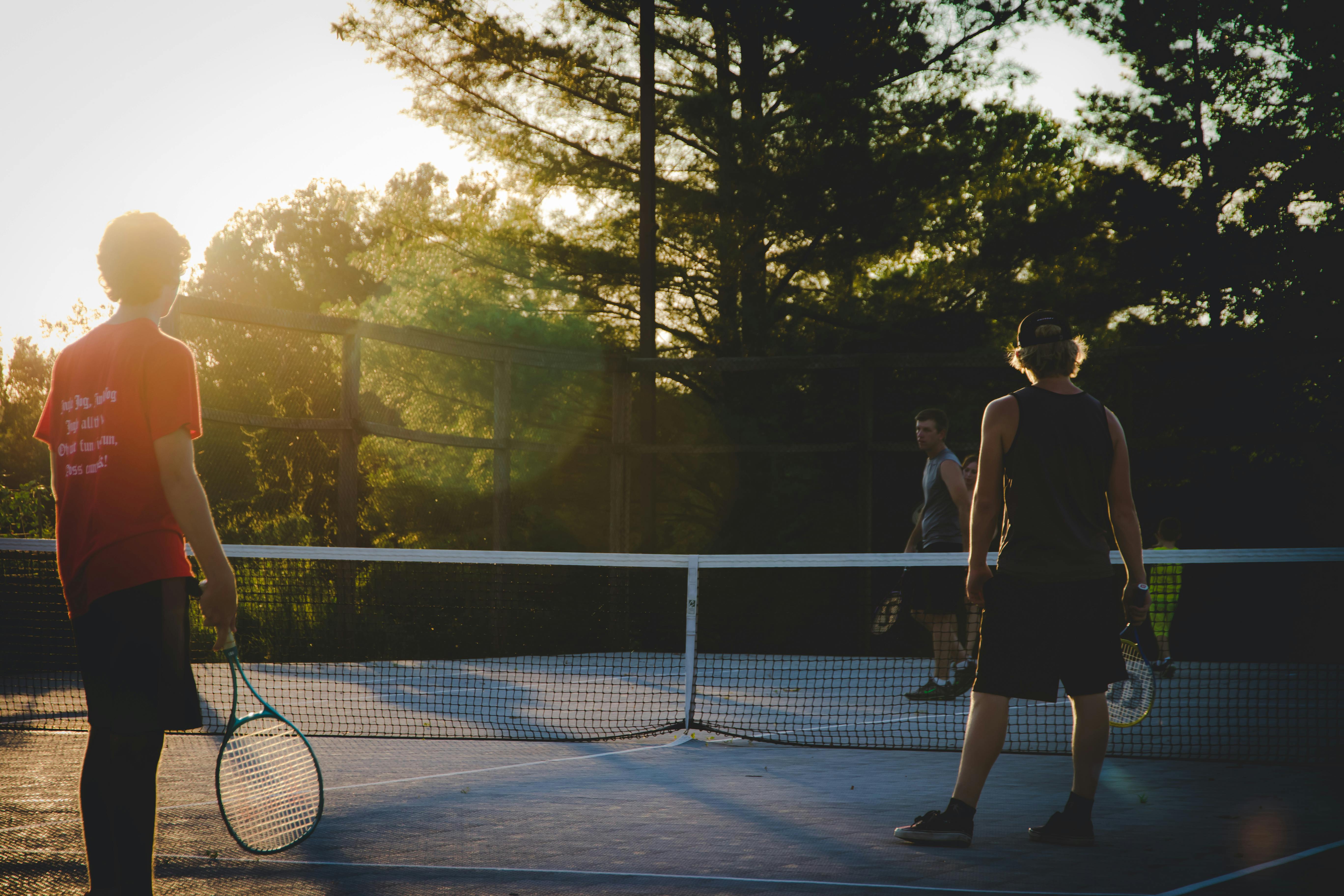 Photo of Three Men Playing Tennis · Free Stock Photo