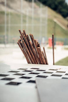 Vertical shot of steel rods on a construction site, capturing industrial details.