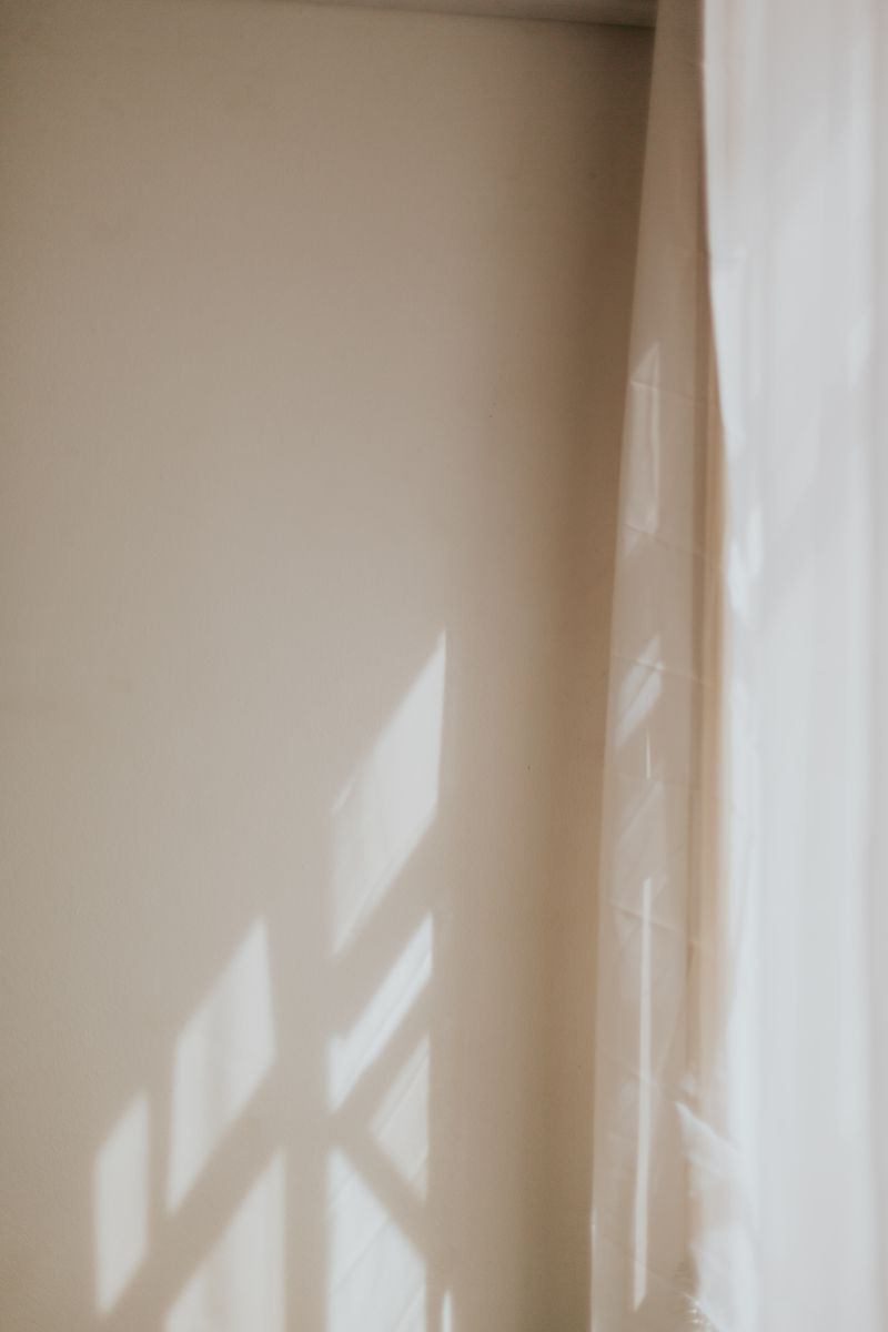 Light and shadow on a curtain and wall