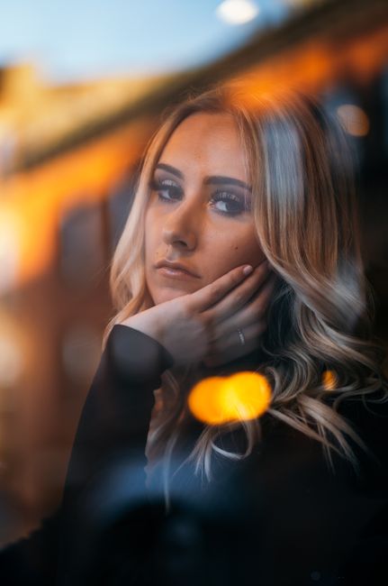 Beautiful portrait of a woman with reflective bokeh effects in Chicago.