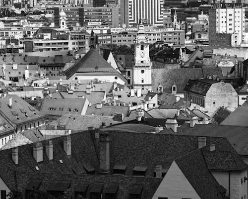 A black and white photo of a city with a lot of buildings