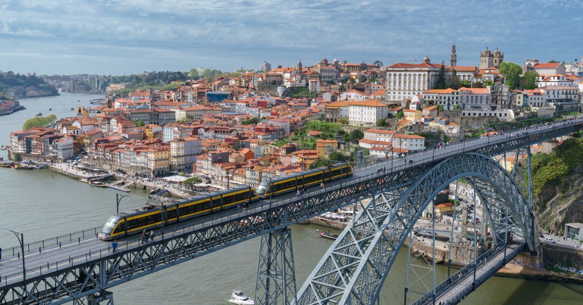 Stunning aerial shot of the iconic Luís I Bridge spanning the Douro River in Porto, Portugal.