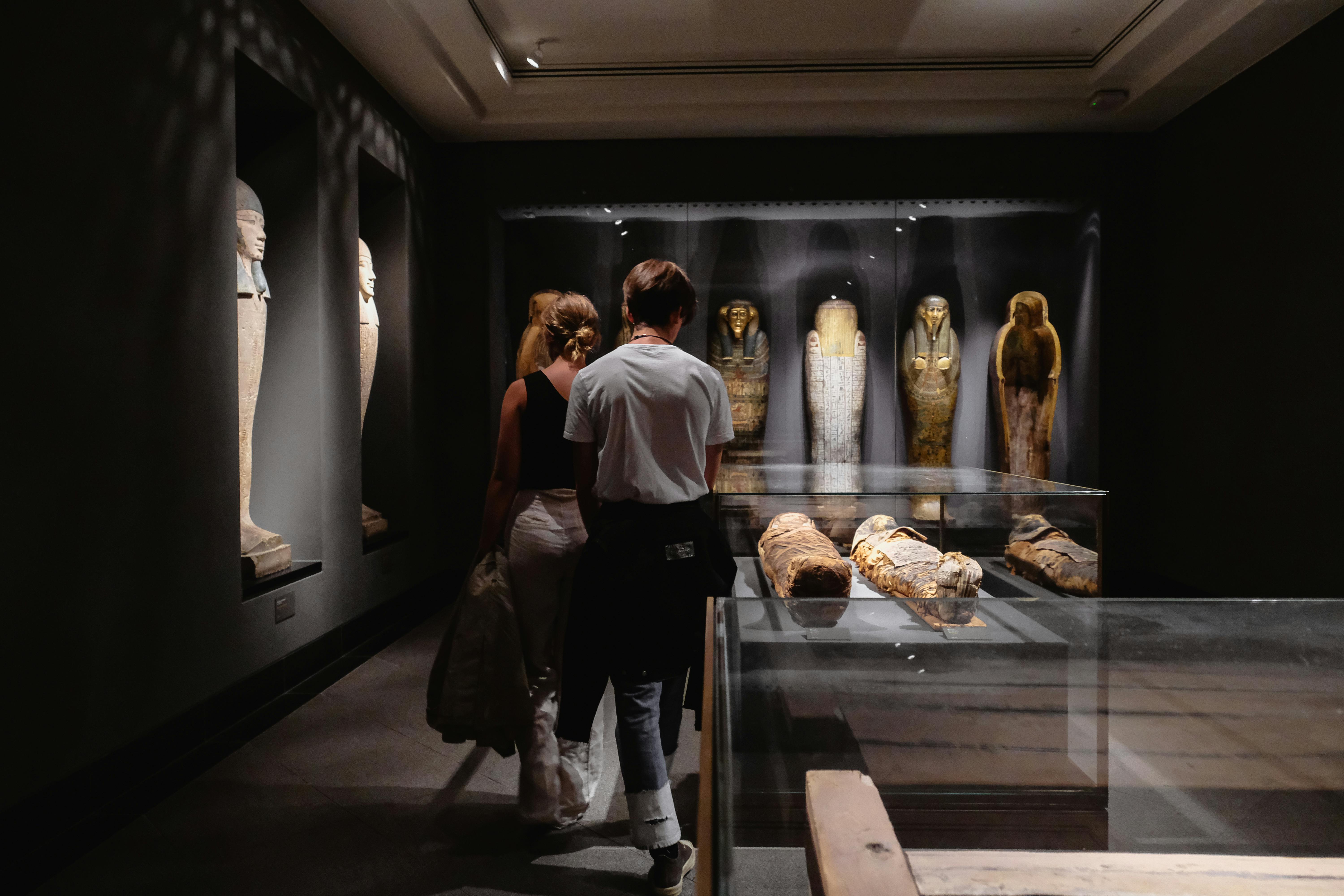 man and woman across mummies