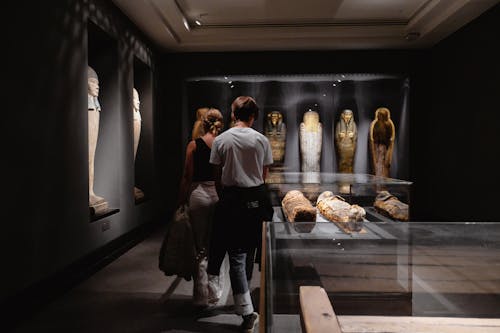 Man and Woman Across Mummies