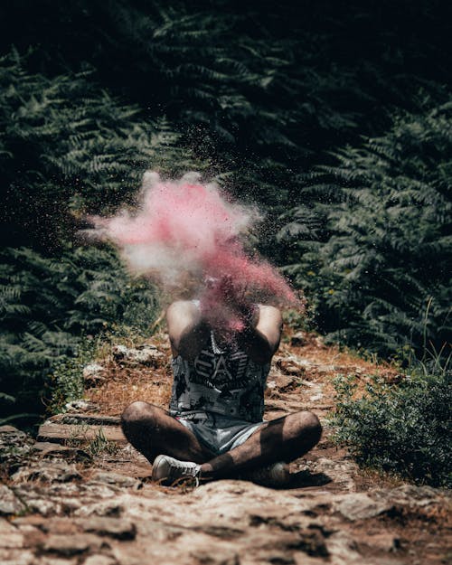 Man Sitting Beside Plants