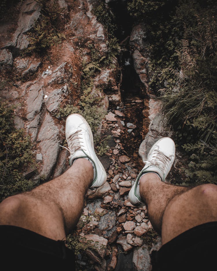 Person Wearing White Vans Low-top Sneakers