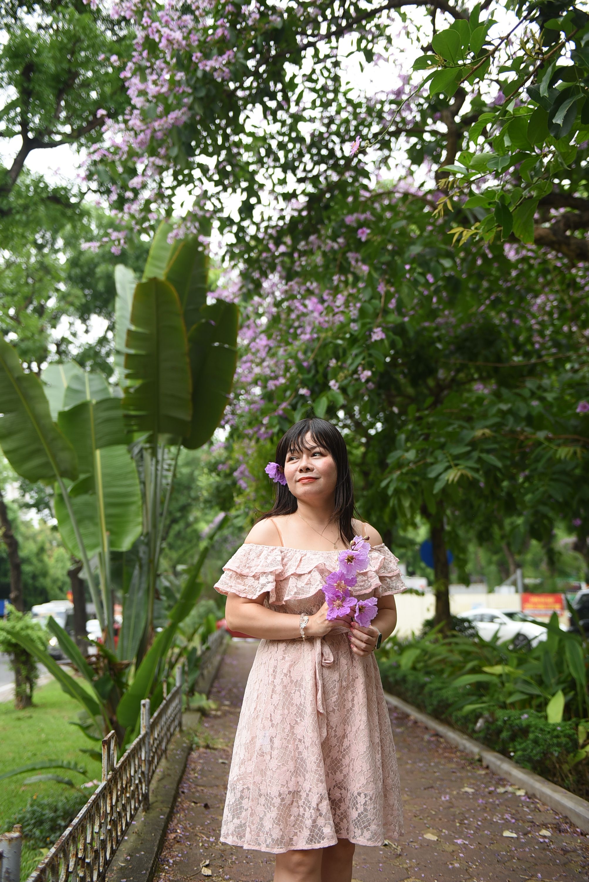 Woman in Pink Dress Holding Flowers in Park · Free Stock Photo