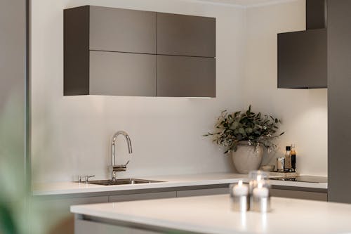 A modern kitchen with a black and white counter