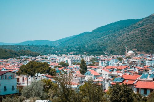 Free Panoramic view of Özdere town's rooftops and lush hills in İzmir, Turkey. Stock Photo