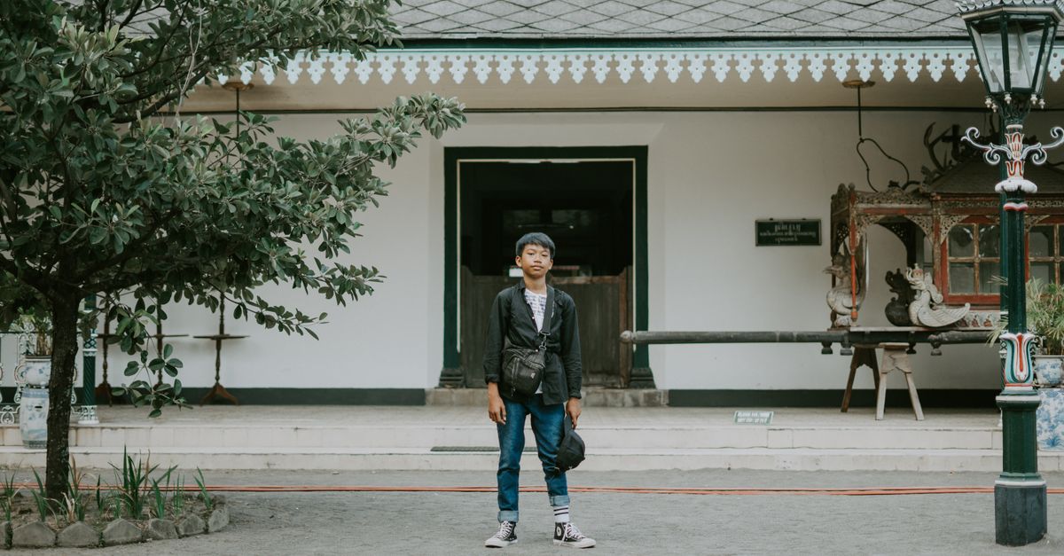 Standing In Front Of Person Standing In Front Of A Building · Free Stock Photo
