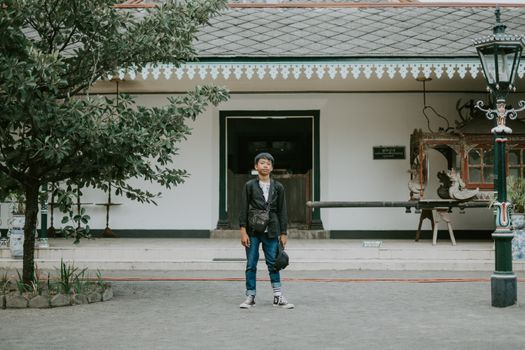 Person Standing In Front Of A Building