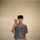 Man Taking Selfie In Front Of Mirror