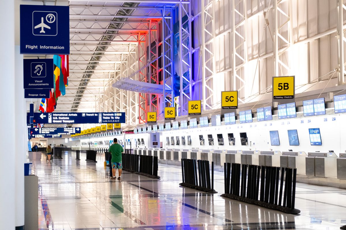 Traveler waiting comfortably inside a modern airport terminal