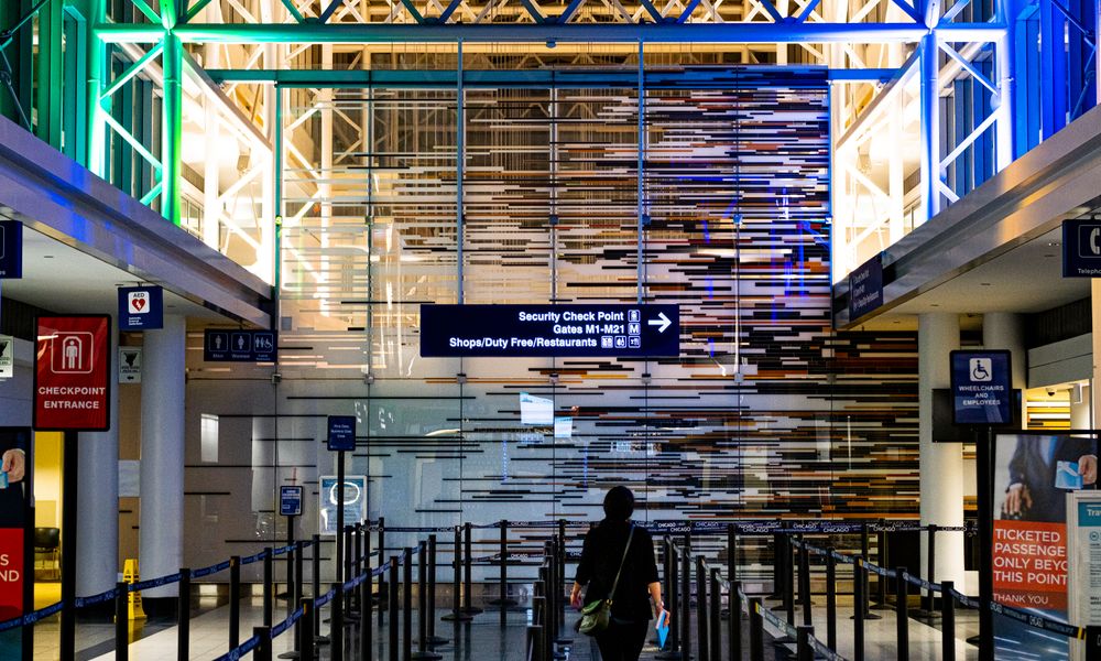 traveler at an automated airport security gate