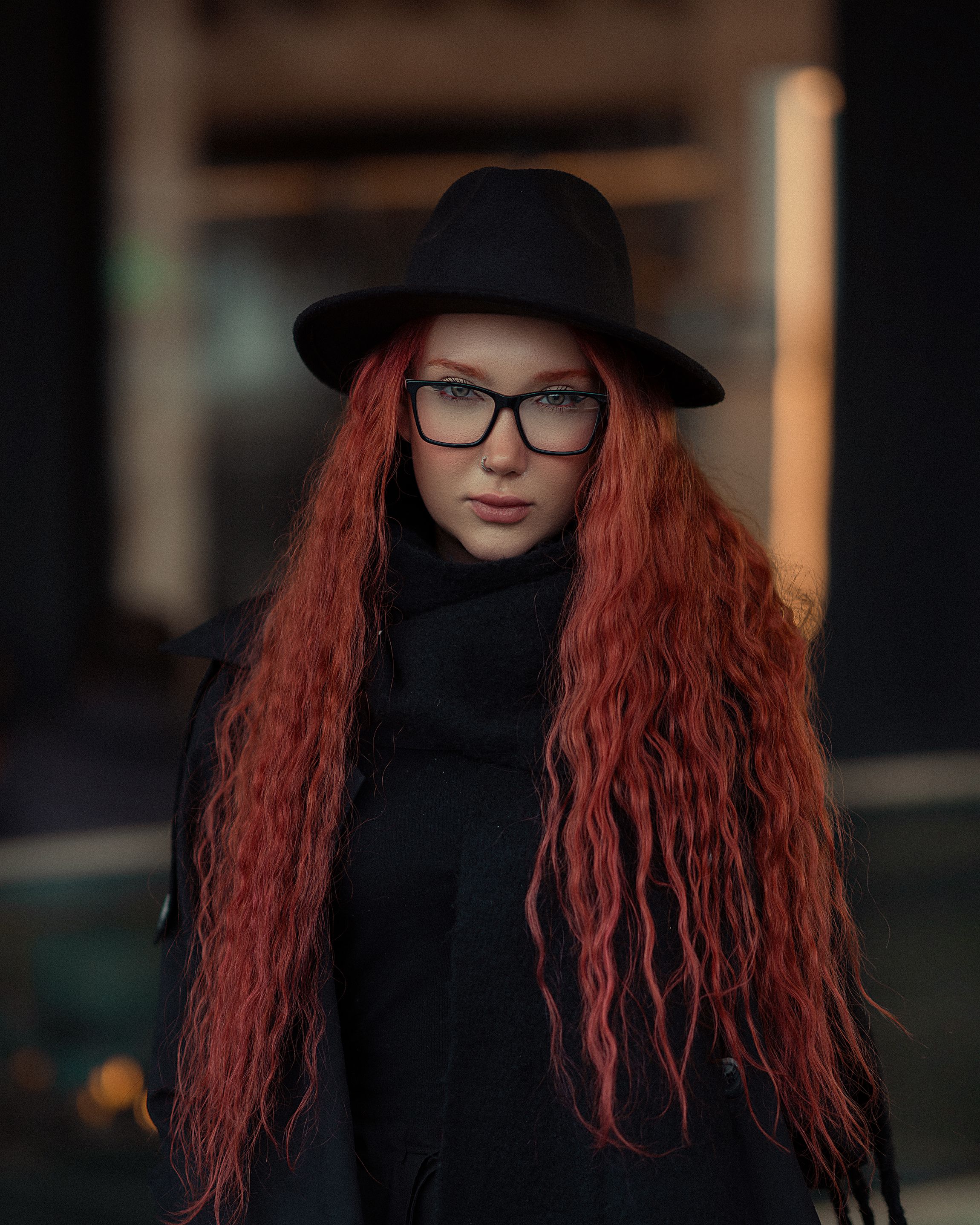 Photo of a Young Woman with Long Red Hair, Wearing Black Clothing and a ...
