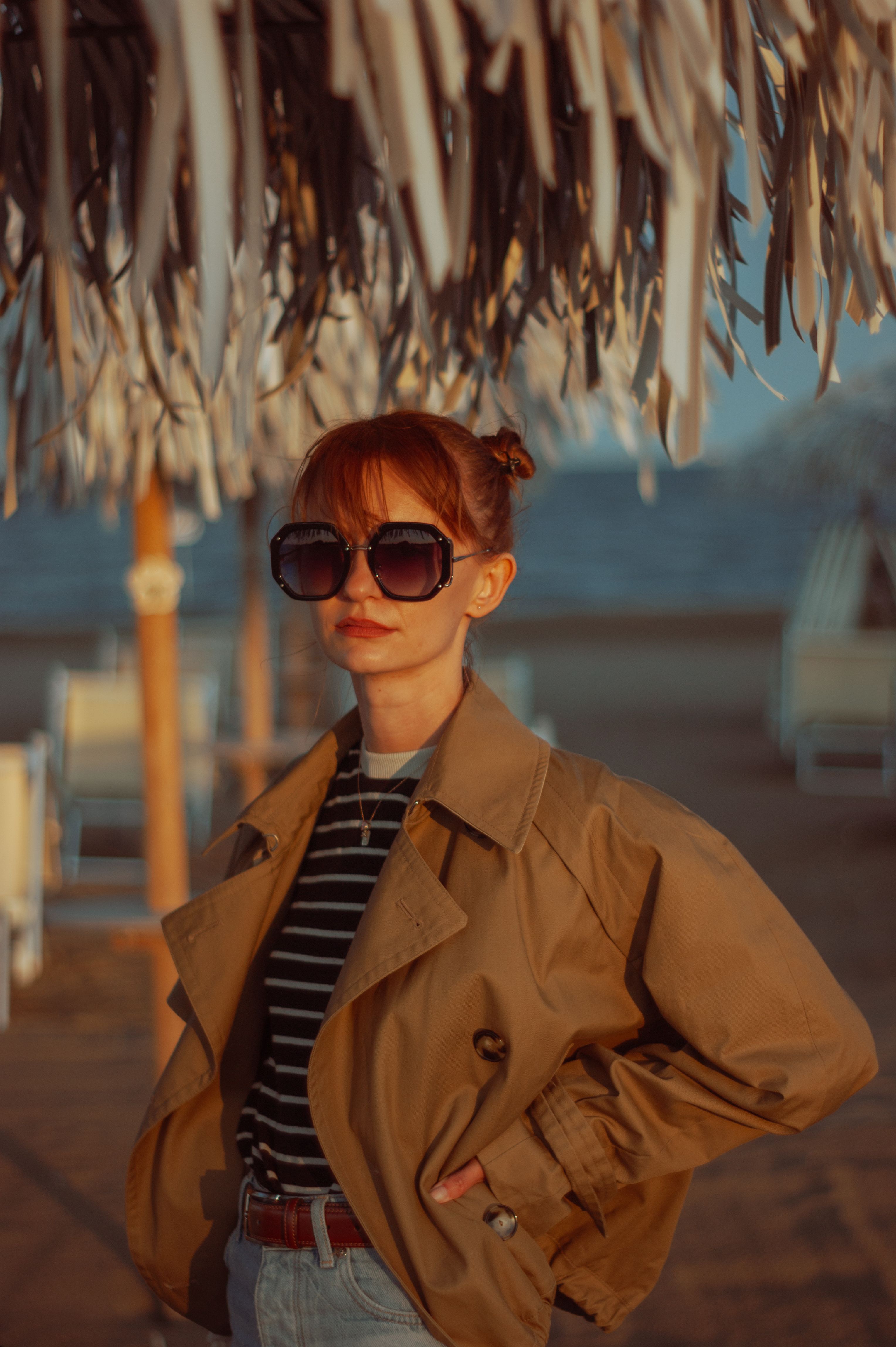 Portrait of Woman Wearing Trench Coat in Sunlight · Free Stock Photo