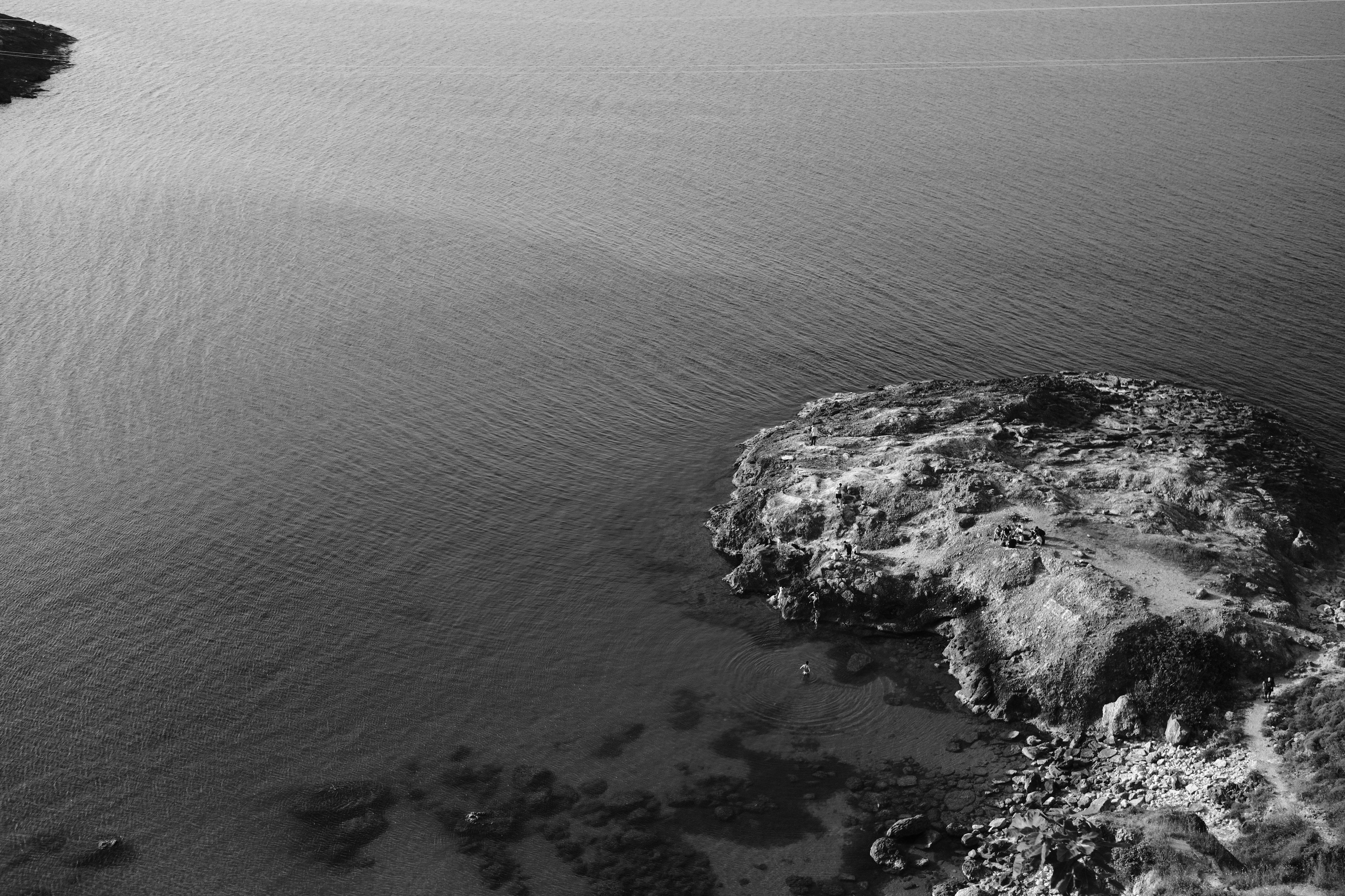 Aerial View of a Rocky Coast And the Sea, Black And White · Free Stock ...