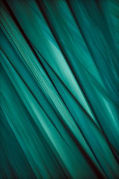 Intricate teal fabric with fluid lines creates a contemporary abstract art design.