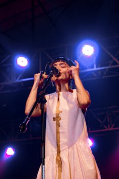 A female singer captivates the audience during a live concert in Indonesia.