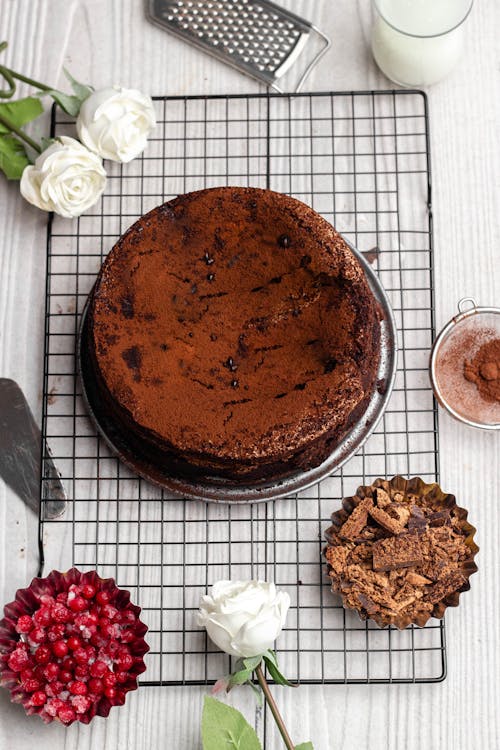 A chocolate cake with strawberries and pomegranate