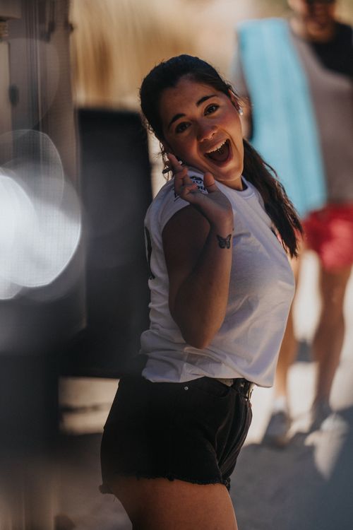 Free Smiling young woman in casual attire having fun outdoors in Palma, Spain. Stock Photo
